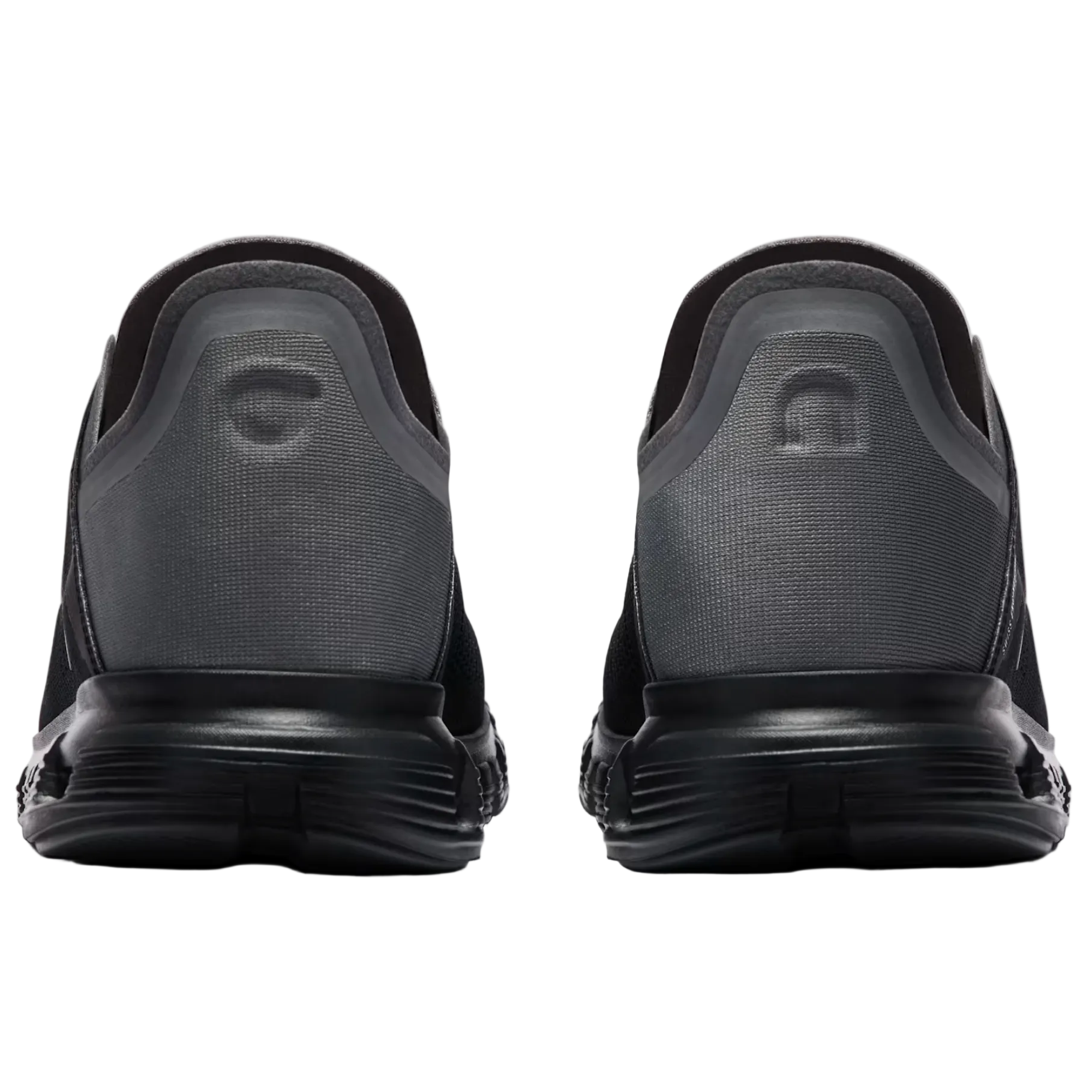 Black athletic shoes shown from the back on a light gray background