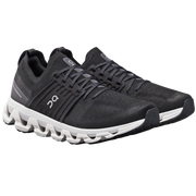 Black running shoes with white sole on a white background