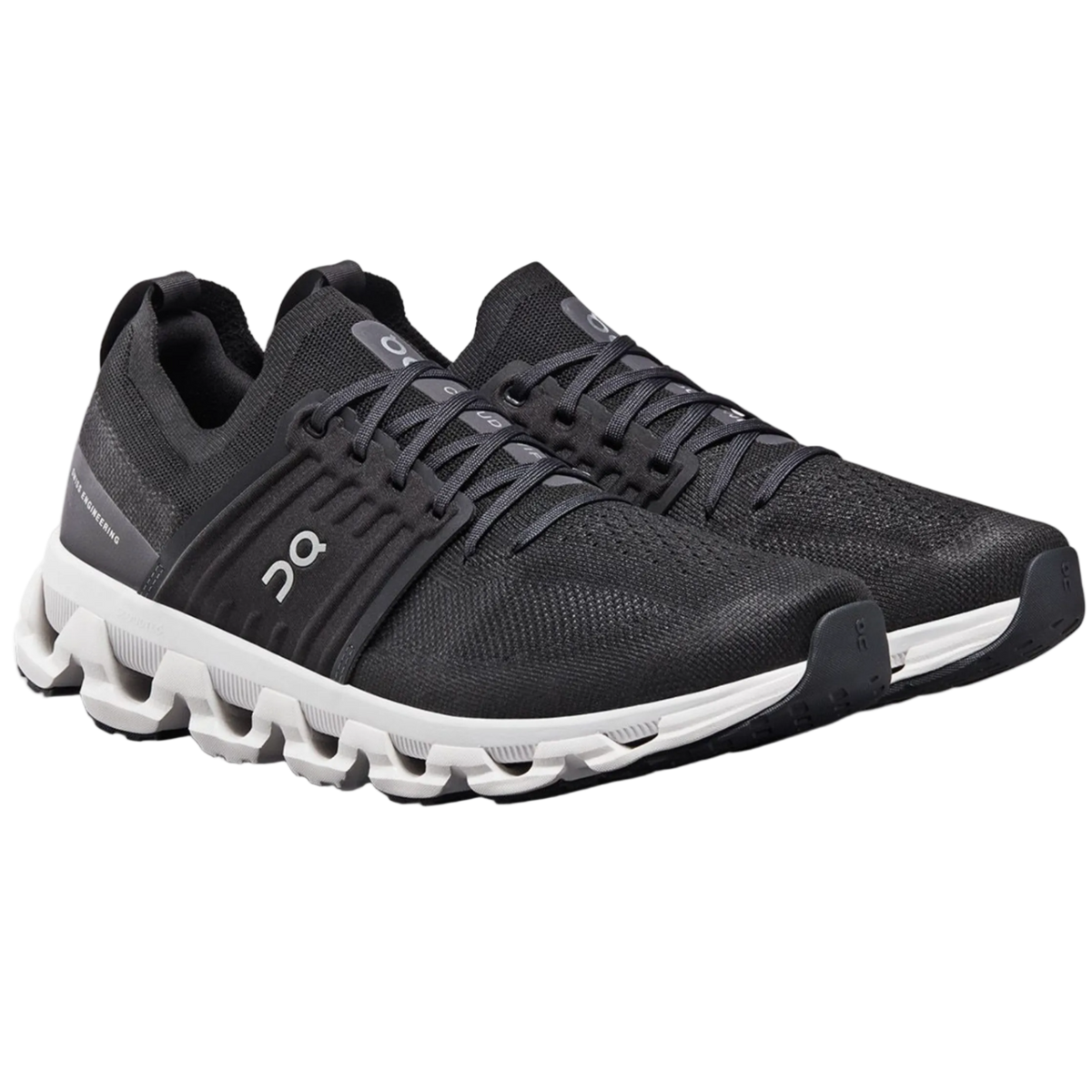 Black running shoes with white sole on a white background
