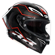 A full-face motorcycle helmet in glossy black with a carbon fiber pattern, featuring red and white graphic accents and a clear visor, shown against a light gray background.