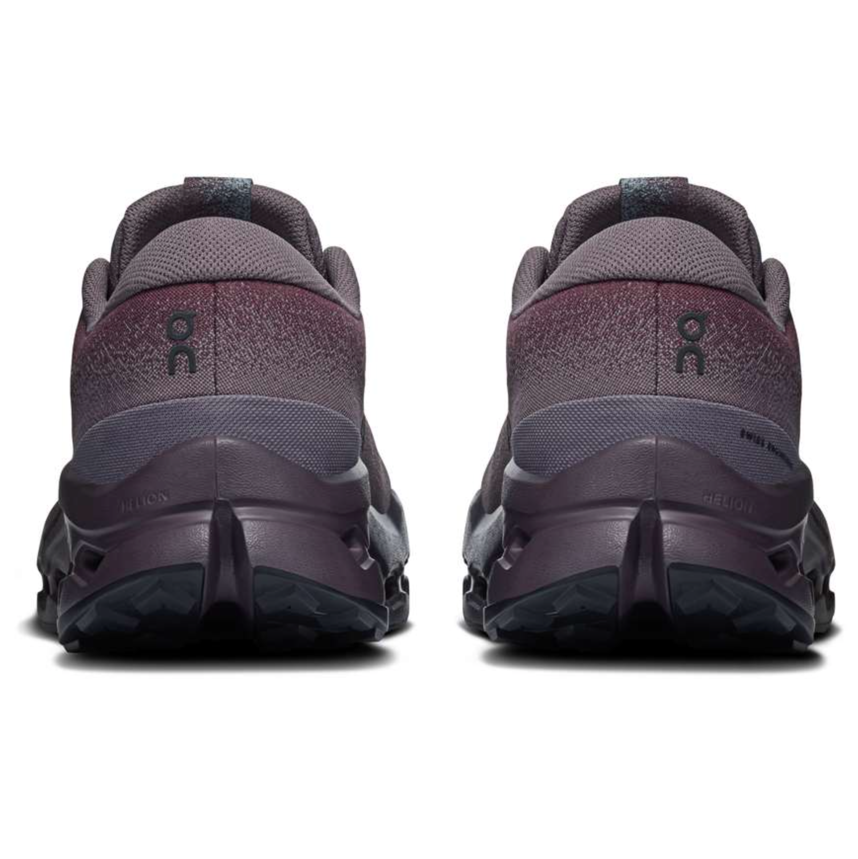A pair of On running shoes shown from the rear, featuring a dark gray and purple gradient upper with black soles, set against a plain white background.
