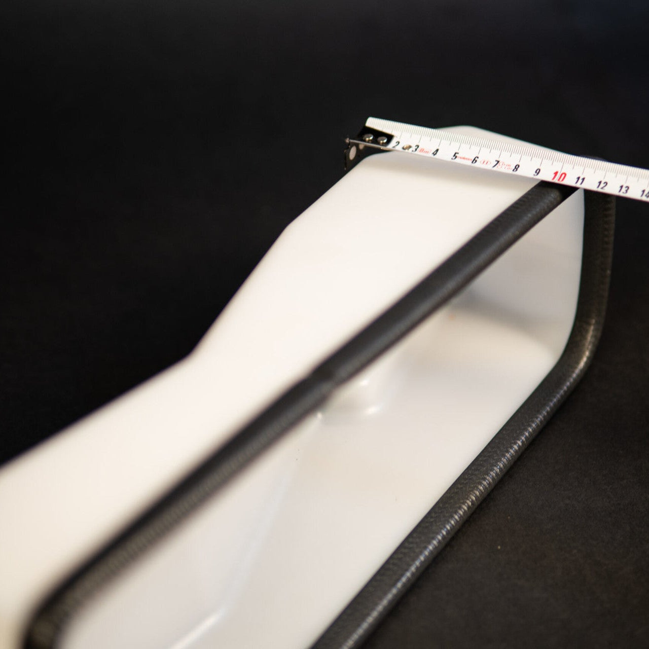 Phone case with a measuring tape on a black background